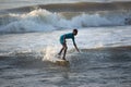 Kovalam, Chennai, Tamilnadu, India - Ã¢â¬Å½Ã¢â¬Å½August 9th Ã¢â¬Å½2021: Young boy Indian surfer surfing and practicing on the beach waves